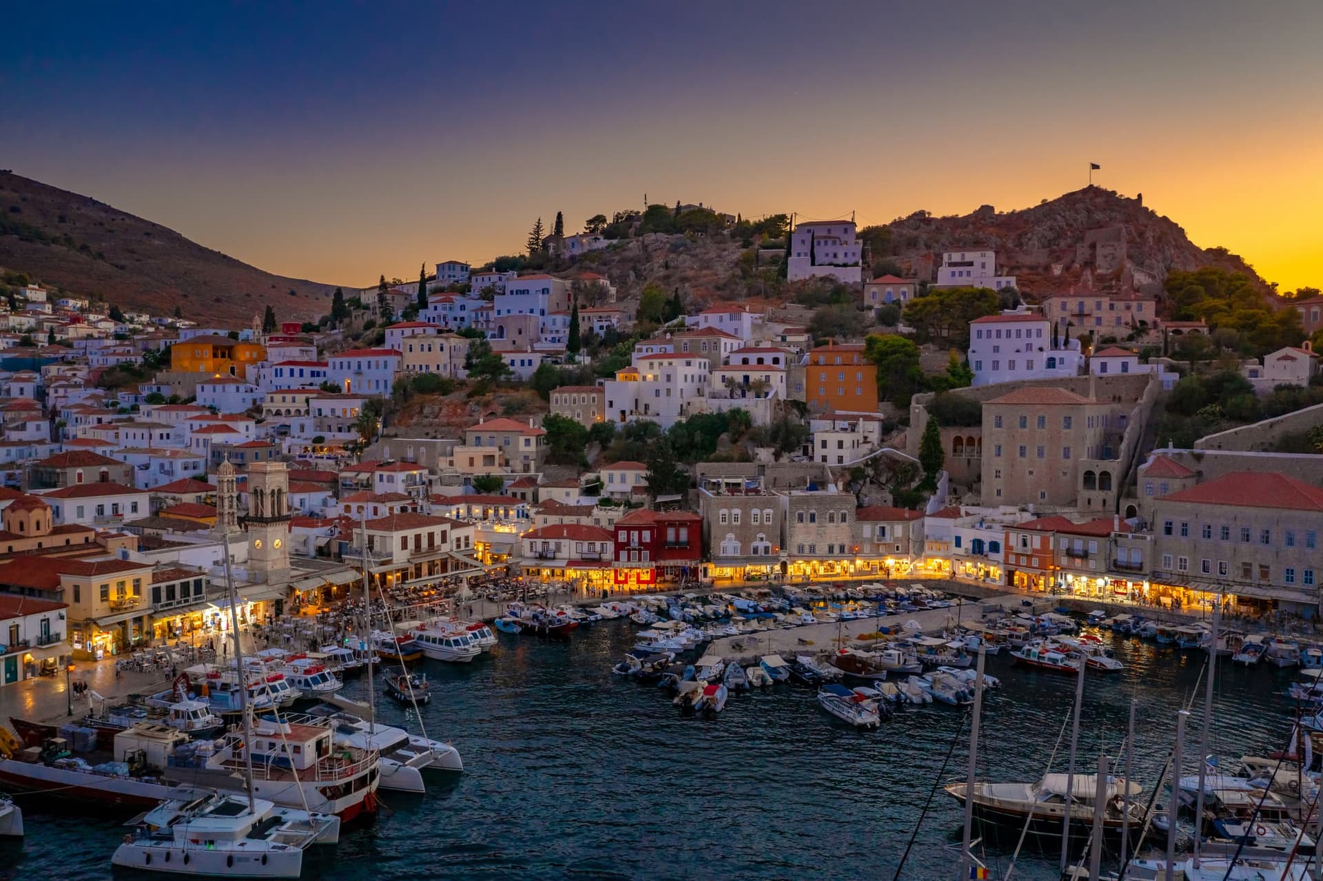 Beautiful Hydra in Greece lit up at night time. 