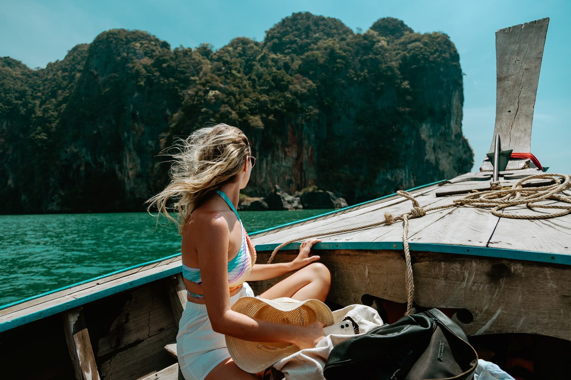 Decorative photo of a woman island hopping in Thailand.